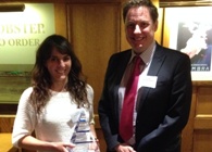 Ally Evans receives her award from Gary Reed, Director of Research, Business and Innovation at Aberystwyth University.
