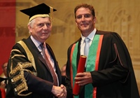Sir Emyr Jones Parry, Chancellor of Aberystwyth University, presents Iolo Williams as Fellow