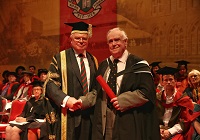 Peter Williams collecting Honorary Fellowship in memory of his brother Bill Williams, from Aberystwyth University Treasurer Dr Timothy Brain OBE