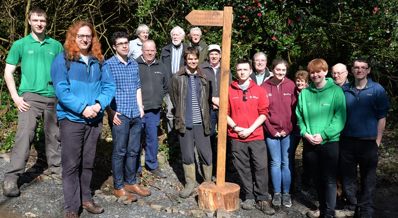 Members of Aberystwyth Conservation Volunteers and the local community celebrate the official opening of the new path in Penglais Woods.