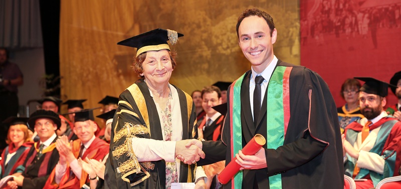 Aled Haydn Jones being presented with an Honorary Bachelor of Arts Degree from Deputy Chancellor Elizabeth France.