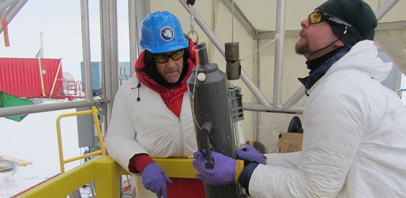 Dr Andrew Mitchell (right) and Professor John Priscu from Montana State University with a water sample brought up from Lake Whillans, which lies 800 metres below the West Antarctic Ice Sheet. Photo: J Mikucki