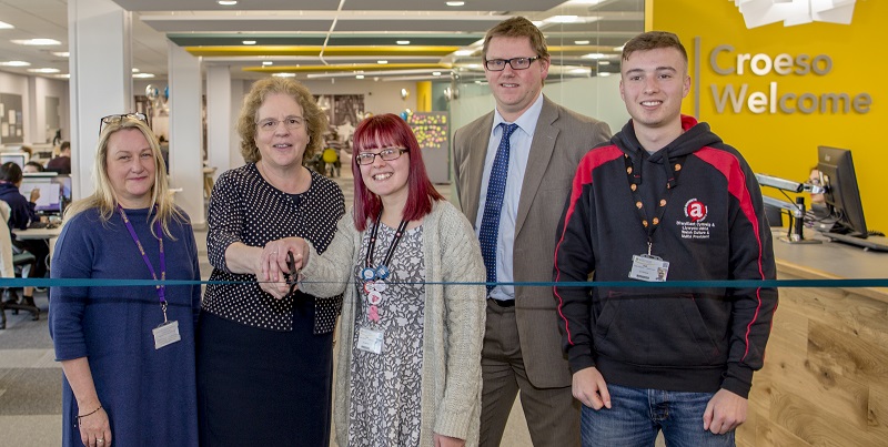Cutting the ribbon to officially open the refurbished Level D, Hugh Owen Library.  Left to right:  Julie Hart (Deputy Director of Information Services, Aberystwyth University), Professor Elizabeth Treasure (Vice-Chancellor, Aberystwyth University), Emma Beenham (Academic Affairs Officer, Aberystwyth Students Union), Tim Davies (Director of Information Services, Aberystwyth University), Gwion Llwyd (Welsh Culture Officer & UMCA President, Aberystwyth Students’ Union)