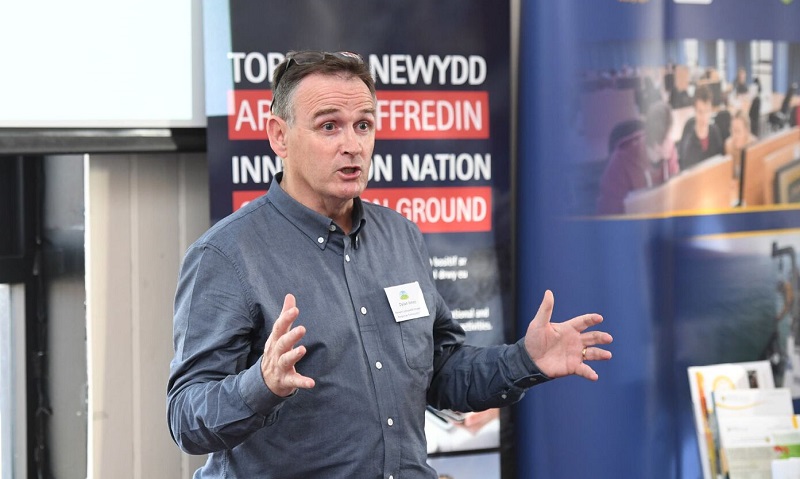 Dylan Jones, Chair of the Penparcau Community Forum, speaking in Cardiff Bay at the launch of HEFCW’s Innovation Nation: On Common Ground report.