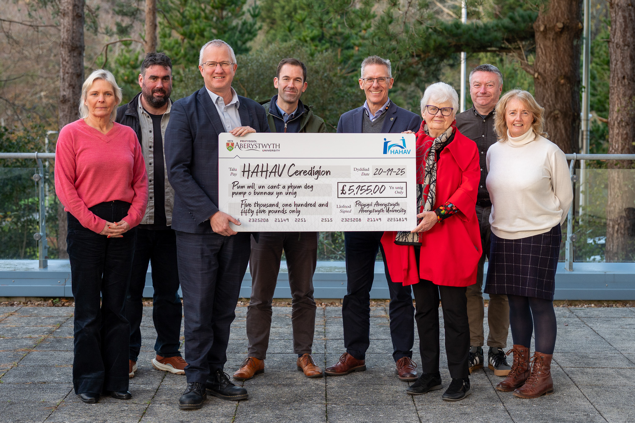 Vice Chancellor, Professor Jon Timmis and University staff presenting a cheque to Gwerfyl Pierce Jones, chair of HAHAV Ceredigion.