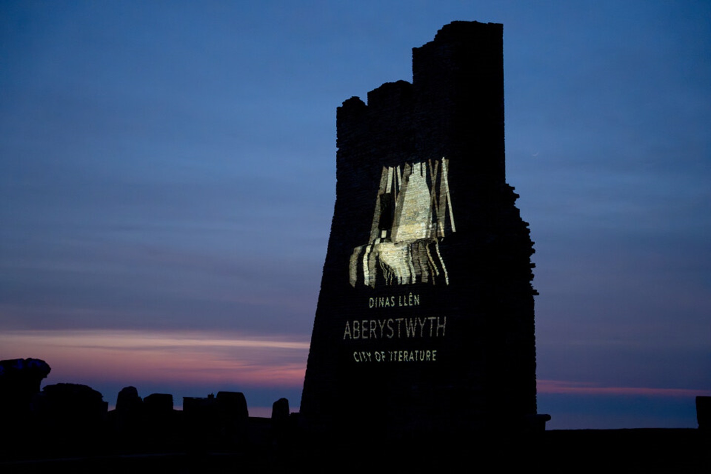 Artwork projected onto Aberystwyth castle – Credit: Angharad Bache