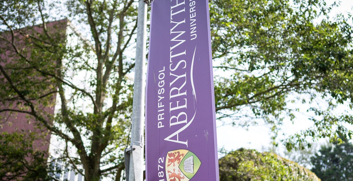 Banner with Aberystwyth Logo in purple