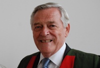 Dr Clive James.