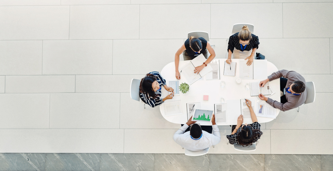 Group of people sat around a table