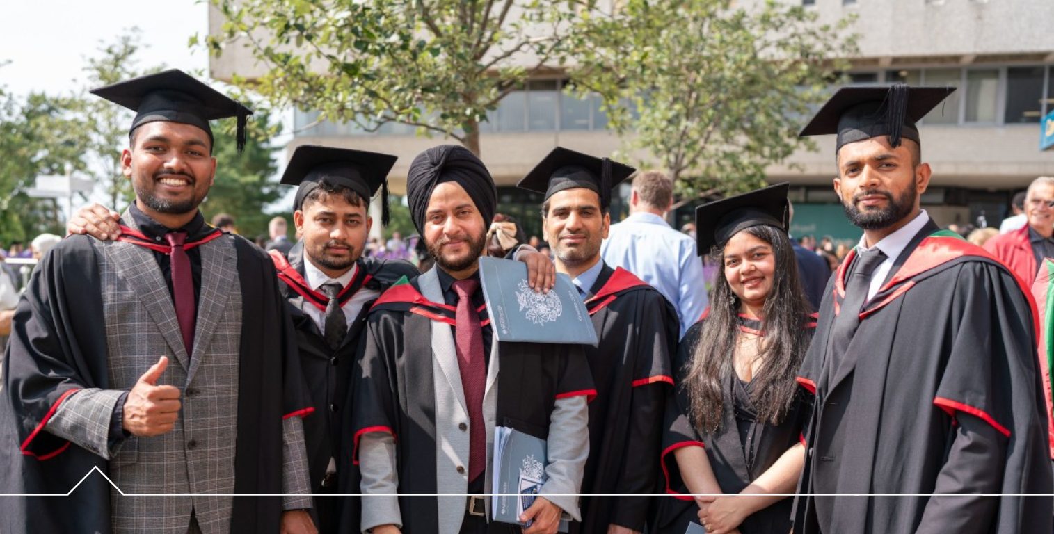 Graduates in front of the Arts Centre