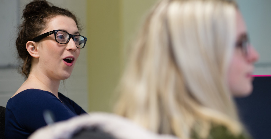 Two female students in a Seminar