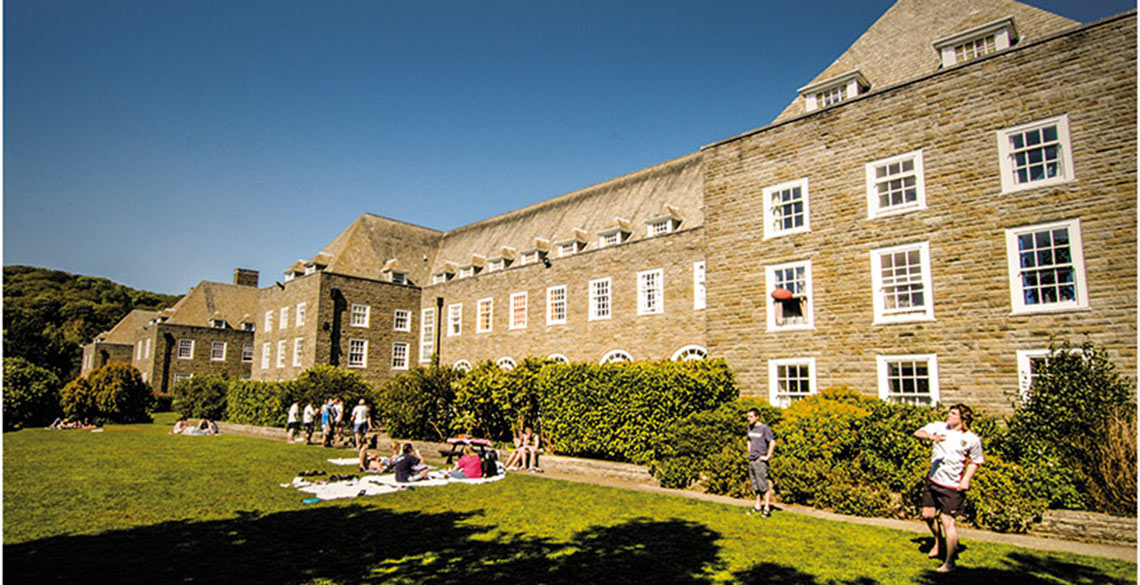 Students out on the lawn outside Pantycelyn Hall