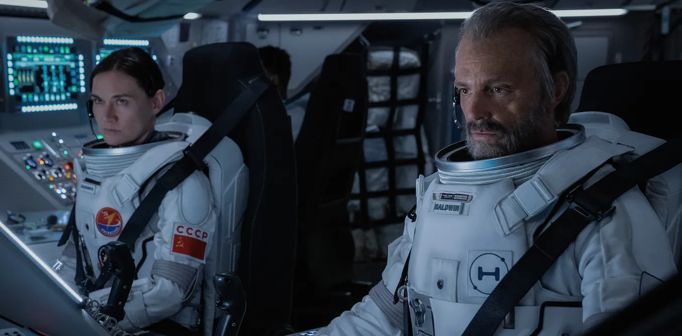 Masha Mashkova and Joel Kinnaman in For All Mankind. Apple TV+