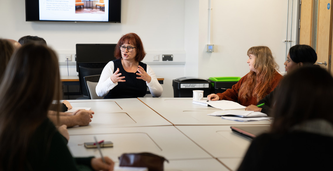 A lecturer leading a seminar at Aberystwyth University.