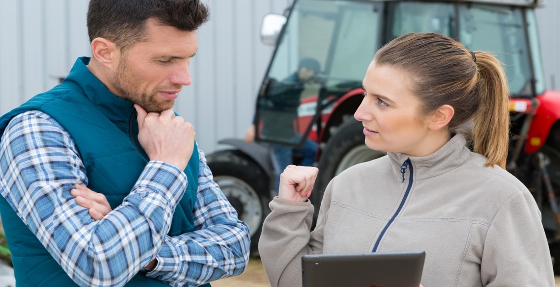 Farmer discussing innovation with research consultant