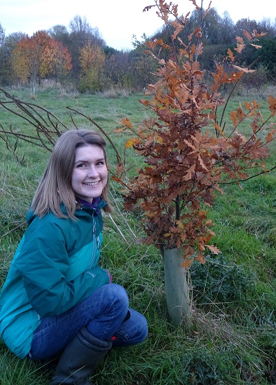 Catherine Duerden with a tree shelter