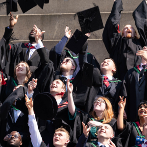 Graduates throwing caps in the air