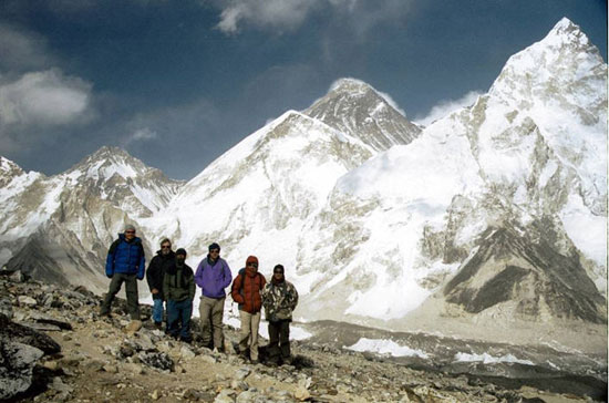 The field party with Sherpa guides above the Khumbu Glacier, with Mount Everest in the background and Nuptse to the right. Photo: D. Quincey.