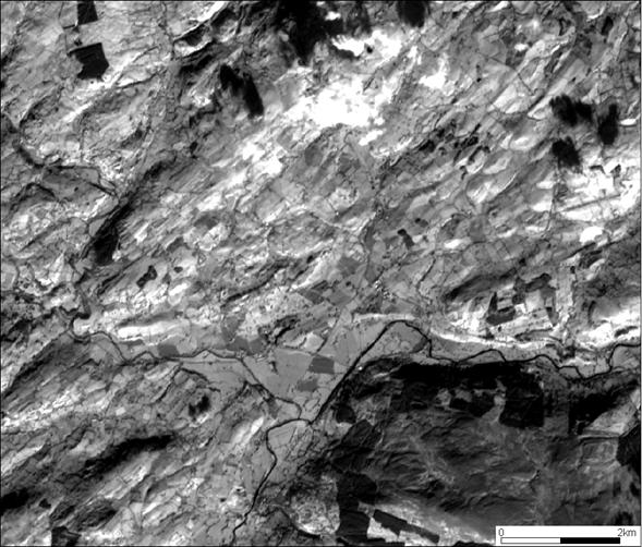 SPOT satellite image, covering the Carrog area, North Wales. The image shows glacial lineations indicating ice flow towards northeast, forming part of the Bala Ice Stream.