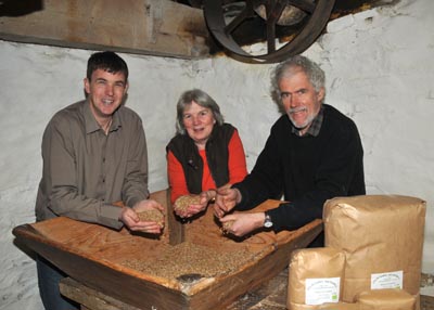 Dr. Huw McConochie from IBERS (left) with Anne and Andrew Parry at the Felin Ganol water mill.