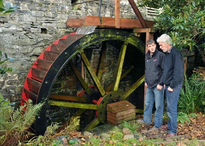 Dr. Huw McConochie from IBERS with Andrew Parry at the Felin Ganol water mill.