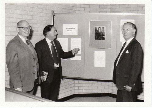 Exhibition of works donated by Esther Elias, Hugh Owen Library, 11 June 1986. Features left to right: W. Dieneman (Librarian); Dr. Gareth Owen (Principal); Lord Emlyn Hooson (President). 