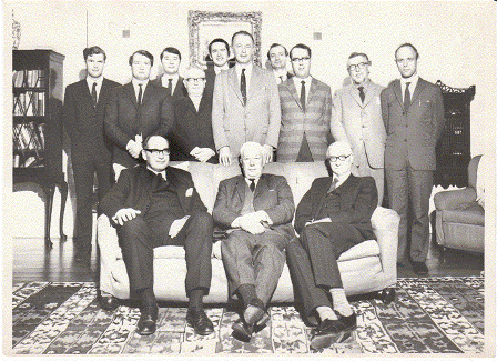 50th anniversary of the formation of the Department of International Politics, Gregynog, 1969. Left to right: R. Ovendale; J.C. Garnett; Ken Booth; Ieuan John; Keith Hamilton; Trevor Ellis Evans (Head of Department); Moorhead Wright; David Steeds; S.R. Purnell; Brian Porter; seated: Sir Goronwy Hopkin Daniel (Principal); Sir Ben Bowen Thomas (President); unknown. 