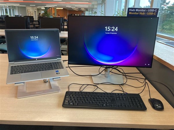 Image showing a laptop on the left with a USB-C Monitor on the right