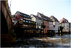 colourful houses next to a river 