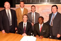 Sitting (from left to right): Professor Noel Lloyd, Joint Chairman of the UWA and UWB Research and Enterprise Partnership; Dr Kandeh Yumkella, Director General of The United Nations Industrial Development Organisation. Standing (from left to right): Dr Huw Aldridge and Dr Paul Brewer from the University of Wales Aberystwyth; Colin Iago and Alan Davies from the University of Wales Bangor.