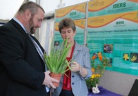 Professor Jamie Newbold speaking to Education Minister Jane Hutt after the announcement