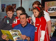 Phil Bennett (centre) with year 6 pupils from Ysgol Dewi Sant, Llanelli