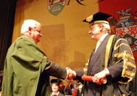 Mr Dyfrig John receives the Honorary Fellowship from Mr Winston Roddick, Vice President of Aberystwyth University.