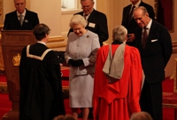 Professor Noel Lloyd and Professor Wayne Powell receive the award from the Queen and the Duke of Edinburgh respectively. Image courtesy of BCA Ltd.