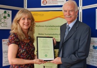 Jo Strong from the Department of International Politics receives the award from Dr John Harries