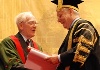 Professor Emeritus Ieuan Gwynedd Jones (left) receives the Fellowship from Sir Emyr Jones Parry.