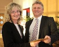 Jac Forster from north Pembrokshire receiving the Welsh for Adults learner of the year award from Dr Malcolm Thomas, Director of the School of Education and Lifelong Learning