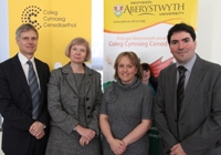 Left to Right: Professor Aled Jones, Senior Pro Vice-Chancellor, Aberystwyth University, Professor April McMahon, Vice-Chancellor, Prifysgol Aberystwyth, Dr Anwen Jones, Chair of the Aberystwyth University branch of the Coleg Cymraeg Cenedlaethol, and Dr Ioan Matthews, Chief Executive of the Coleg Cymraeg Cenedlaethol.