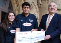 L to R: Aber Rag Vice-President, Rhian McIntosh and President, Ismael Khan presenting the cheque to Mr Philip Thomas of Tŷ Hafan.