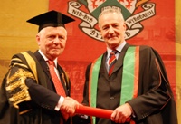Left to Right: Sir Emyr Jones Parry, President of Aberystwyth University, receives Professor Michael Clarke as Fellow of the University.