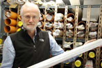 Dr Henry Lamb holding a section of core from Lake Suigetsu, Japan.