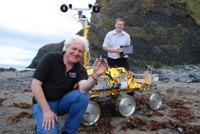 Professor Dave Barnes (left), holding a prototype of the PanCam colour calibration target, and Dr Stephen Pugh during trials undertaken with ‘Bridget’, a full size Exo-Mars-like rover held at Clarach beach near Aberystwyth in 2010.
