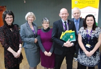 Launching the new Welsh Language Scheme: (L to R) Mari Elin Jones, Manager of the Centre for Welsh Language Services; Professor April McMahon, Vice-Chancellor; Gwenno Piette, Welsh Language Development Officer; Dr Rhodri Llwyd Morgan, Pro Vice-Chancellor for the Welsh Language and Culture and External Relations; Sir Emyr Jones Parry, Aberystwyth University President; and Gwenan Davies from the Department of Welsh and the Centre for Welsh Language Services.