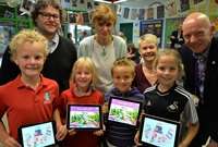 (Left to Right) Ysgol Gymraeg Aberystwyth pupils Ioan Mabbutt, Lleucu Siencyn, Cerian Williams and Modlen Gwynne celebrate the launch of the new apps in the company of Aled Morgan, Ysgol Gymraeg Aberystwyth; Lynwen Rees Jones, Director of CAA; Delyth Ifan, Editor/Projects Manager, CAA; and Dr Rhodri Llwyd Morgan, Pro Vice-Chancellor, Welsh Language and Culture, and External Engagement, Aberystwyth University.