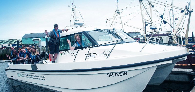 Professor Elizabeth Treasure Vice-Chancellor with Dr Pippa Moore, scheme coordinator of the marine and freshwater biology degree at IBERS and students on board Taliesin.