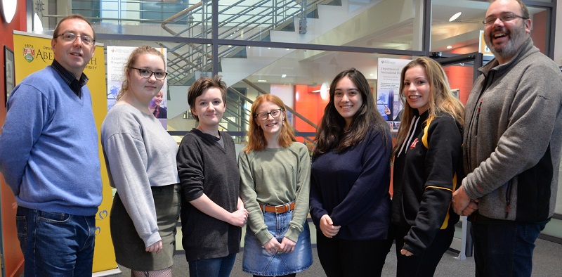 Pictured left to right Professor Gary Rawnsley, Director of International Academic Strategy and Professor of Public Diplomacy, students Samantha Schanzer, Giselle Morris, Marged Smith, Vera Tzoanou and Carys Bevan, and Dr Val Nolan from the Department of English and Creative Writing.