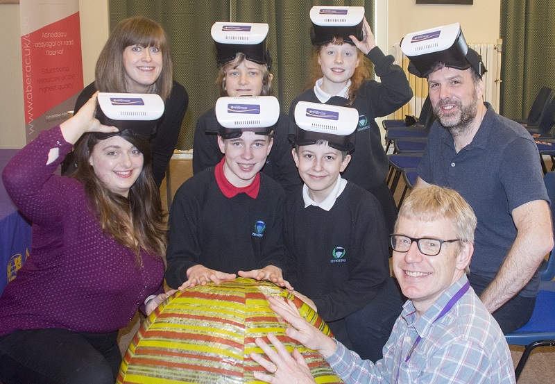 Pictured are Fflur Davies, Assistant Director CAA Cymru (top left),  Dr Huw Morgan (top right), Carys Huntly (front left) and Martin Nelmes (front right) from the Department of Physics at Aberystwyth University with year 7 pupils from Ysgol Gyfun Penweddig at the launch of Cyffro a Rhyfeddod Gwyddoniaeth