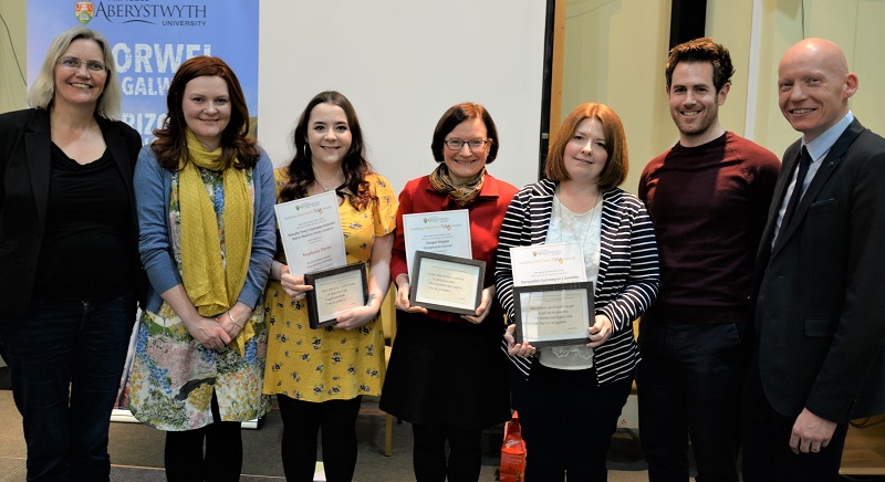 Left to right: Professor Elin Haf Gruffydd Jones, author Caryl Lewis, Stephanie Davies, winner of the Welsh Medium Study award, Lucy Hodson, winner of the Exceptional Learner award, Branwen Davies, winner of the Welsh in the Workplace award, lecturer Eurig Salisbury and Dr Rhodri Llwyd Morgan, Pro Vice-Chancellor.