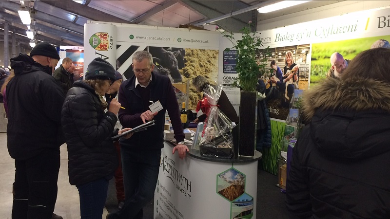 Huw Powell IBERS grassland expert speaking to visitors at the Winter Fair 2017