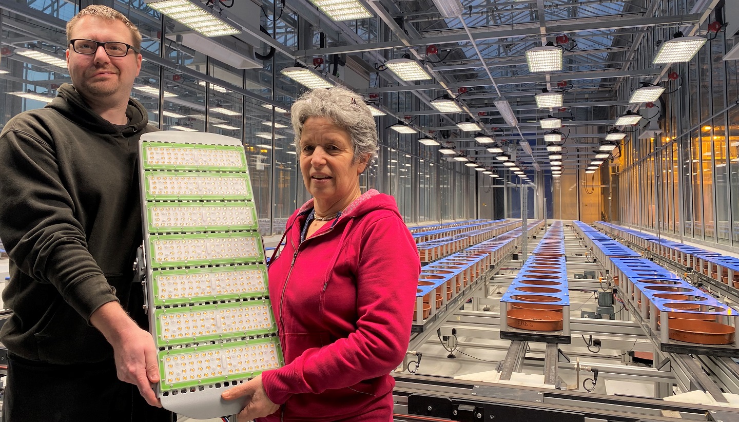 Jason Brook and Fiona Corke from National Plant Phenomics Centre with one of the 96 LED lights that have been fitted to the centre’s main greenhouse at the Institute of Biological, Environmental and Rural Science, Aberystwyth University.